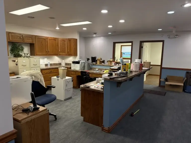 Staff work area behind the reception counter at Northumberland Hearing Center in our new office